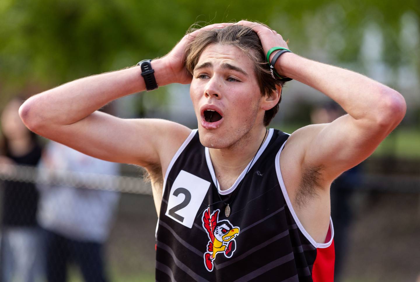 Benet Academy’s Finn Richards celebrates winning the 3200-meter race that qualified him for state finals during the Boys Track and Field Class 3A East Aurora Sectional hosted by East Aurora High School in Aurora on Thursday, May 22, 2025.