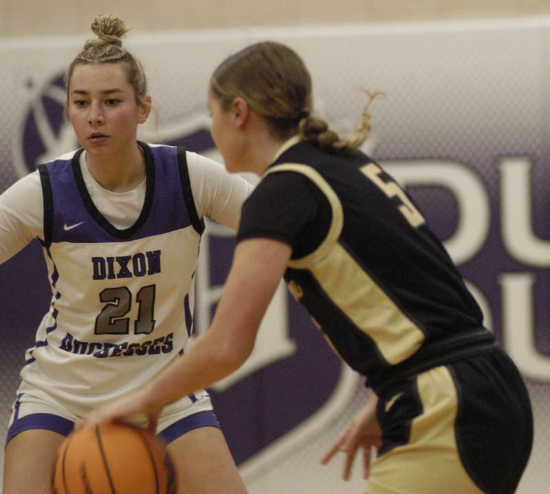 Dixon's Reese Dambman defends against Sycamore's Grace Amptmann as she brings the ball up the court. The Dixon Duchesses beat the Sycamore Spartans 55-47 in a non-conference game played at Lancaster Gym in Dixon on Saturday, December 20th, 2025.