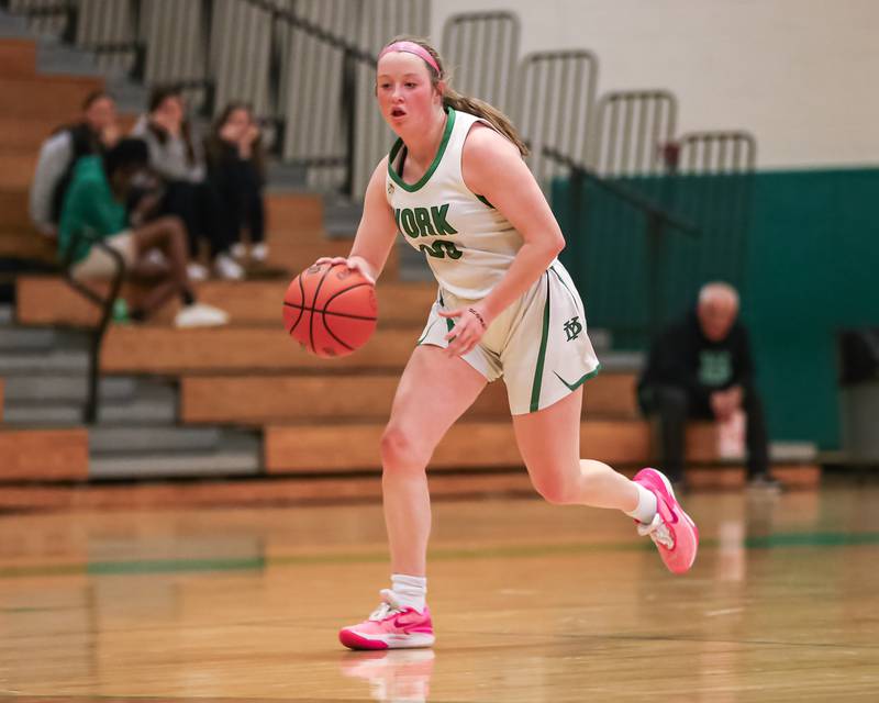 York's Hannah Meyers (20) drives to the basket during basketball game between Hinsdale Central at York. Dec 8, 2023.