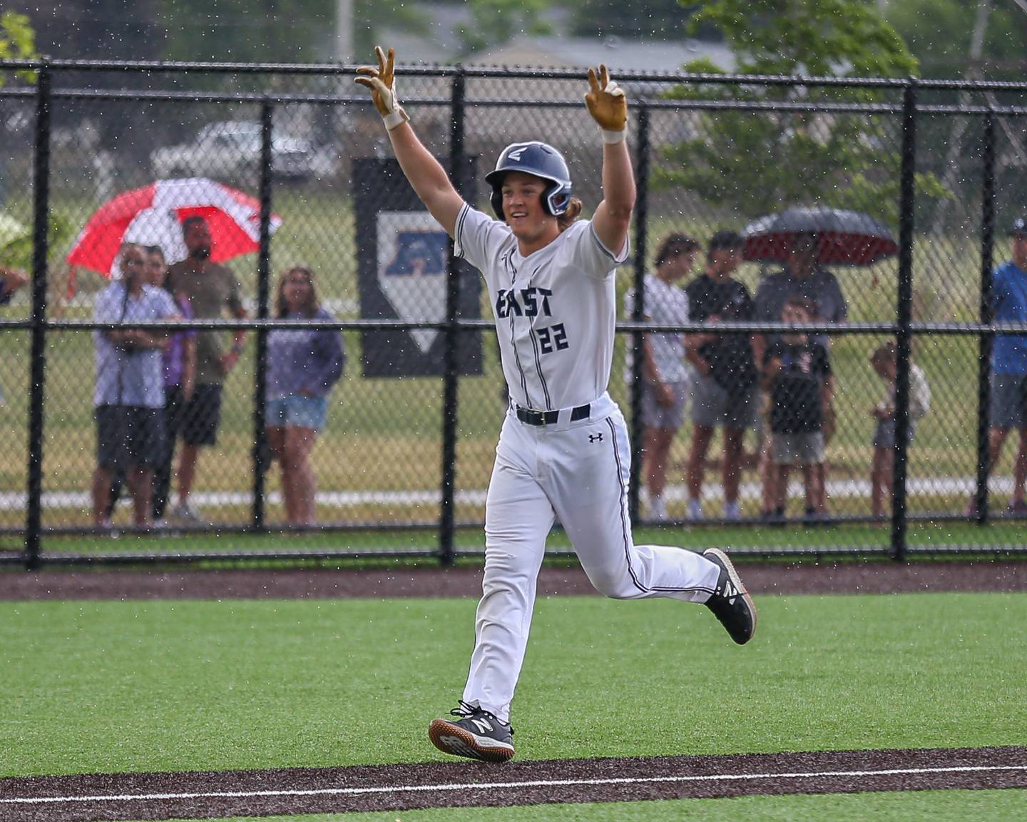 Oswego East's Jackson Petsche (22) rounds the bases after hitting a homerun during Class 4A Romeoville Sectional semifinal between Oswego East at Downers Grove North.  May 31, 2023.