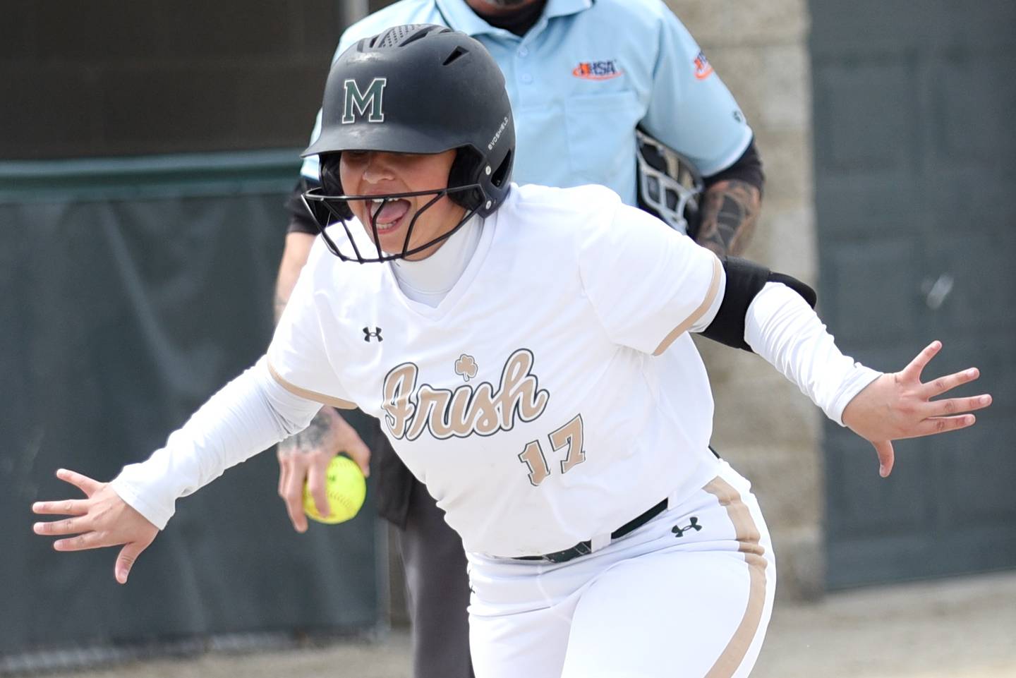 Bishop McNamara's Gabby Burnett celebrates as she approaches home plate following a home run during a home game against St. Laurence Saturday, April 11, 2026.