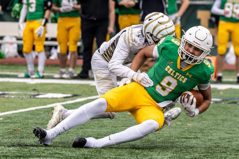 Providence's Curtis Stubbs II gets tackled after making a nice catch during a 5A varsity football semifinal game against Oak Forest at Providence Catholic High School on Nov. 22, 2025.
