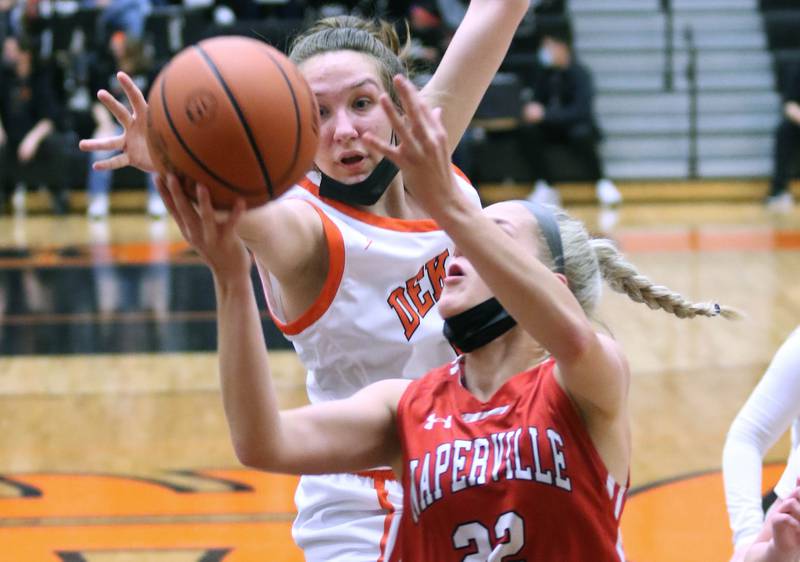 DeKalb's Kailey Porter tries to block the shot of Naperville Central's Natalie Jordan during their game Tuesday, Jan. 11, 2022, at DeKalb High School.