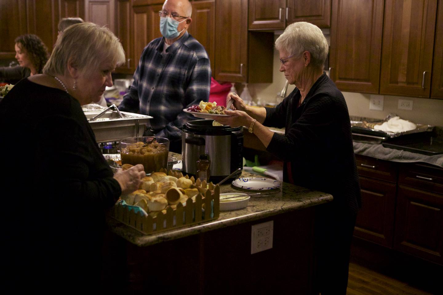 Volunteers serve residents during a Thanksgiving dinner at Gable Point Senior Housing on Saturday, Nov. 19, 2022, in Crystal Lake.