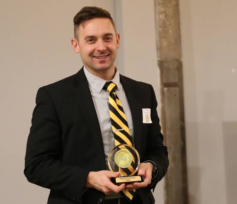 Clayton Theisinger, Superintendent, Putnam County CUSD #535 poses for a photo with his award during the Illinois Valley Chamber of Commerce 40 Under Forty Awards Gala on Thursday, Feb. 9, 2023 at Westclox in Peru.