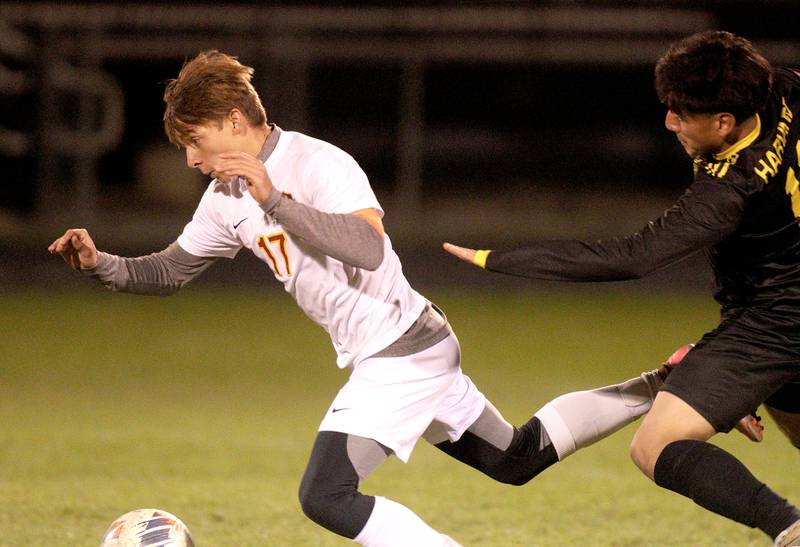 Harvard’s Diego Ramirez, right, gets tangled up with Richmond-Burton’s Joe Kyes in varsity soccer on Monday, Oct. 7, 2024, at Dan Horne Field on the campus of Harvard High School in Harvard.