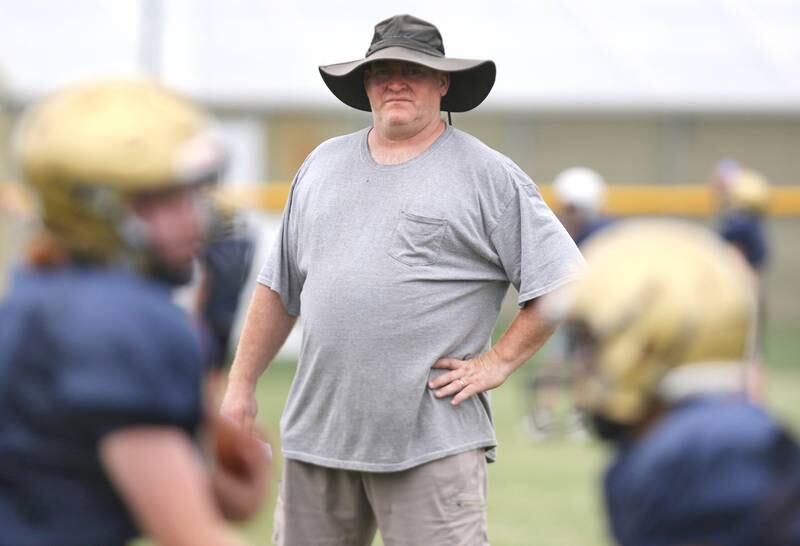 New Hiawatha head football coach Kenny McPeek watches his team run plays during practice Wednesday, August 9, 2023, at the school in Kirkland.