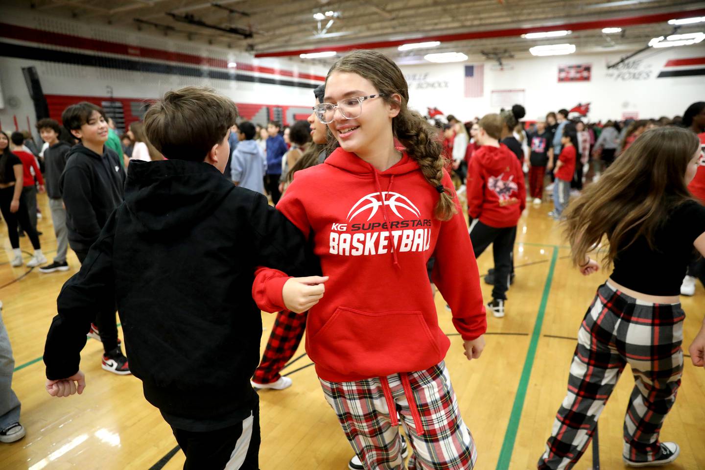 Yorkville Middle School seventh-grader Olyivia Simon participates in the school’s 50th annual Square Dance Jubilee on Friday, Dec. 20, 2024 in Yorkville.