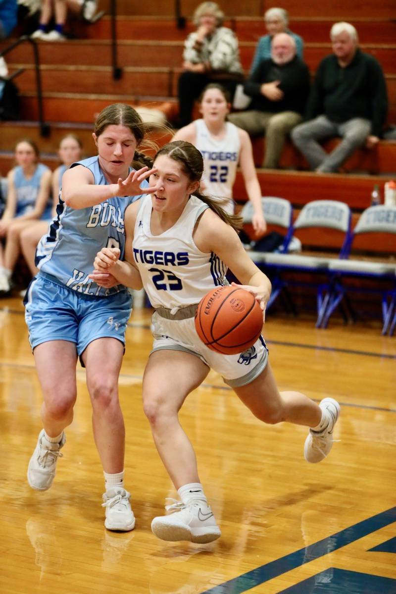 Princeton's Miyah Fox drives on Bureau Valley's Kate Salisbury Monday night at Prouty Gym. The Storm won 55-45.