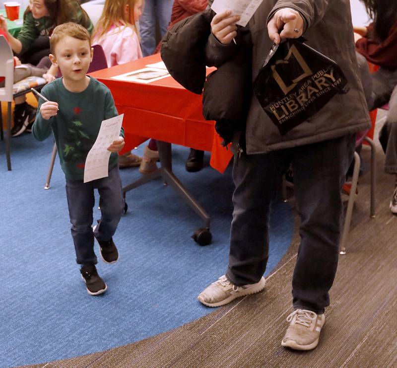 Jacob Day, 5, of Lake in the Hills, gets excited as he finds a reindeer during a scavenger hunt Friday, Dec. 2, 2022, as part of the Very Merry Huntley Holiday Open House at the Huntley Area Public Library. The event featured musical entertainment by Andy Huber, reindeer, Santa, a scavenger hunt, face painting, and a snowball toss.