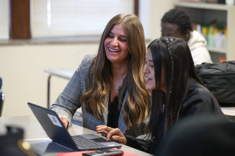 Joliet Central High School teacher Betsy Murray shares a laugh with Yaritza Ibarra Leon while helping her with an algebra assignment on Wednesday, March 1st, 2023 in Joliet.
