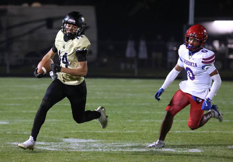 Sycamore's Josiah Mitchell gets by Cahokia's Antonio Morris during their game Friday, Oct. 25, 2024, at Sycamore High School.