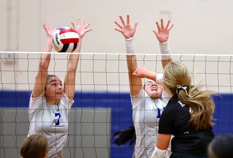 Princeton's Kathy Maciczek (left) and Keely Lawson put up a block against Kewanee Tuesday night at Prouty Gym. The Tigresses won 25-8, 25-22.