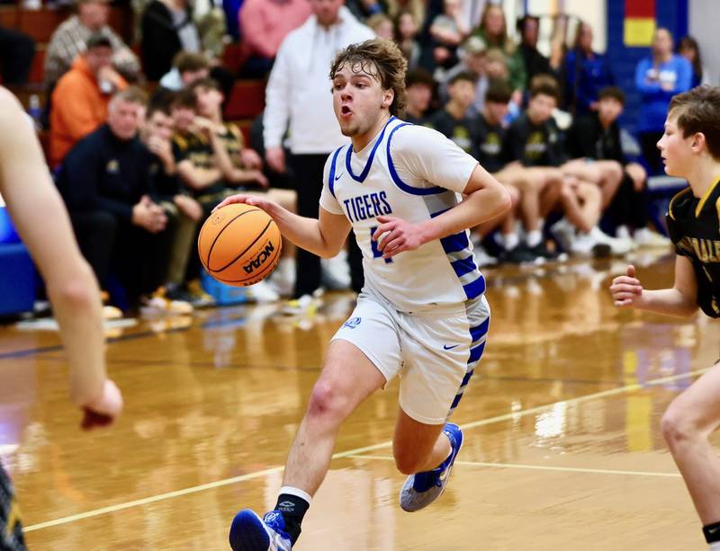 Princeton junior guard Jayden Fulkerson drives against Riverdale Tuesday night at Prouty Gym. The Tigers won 67-60
