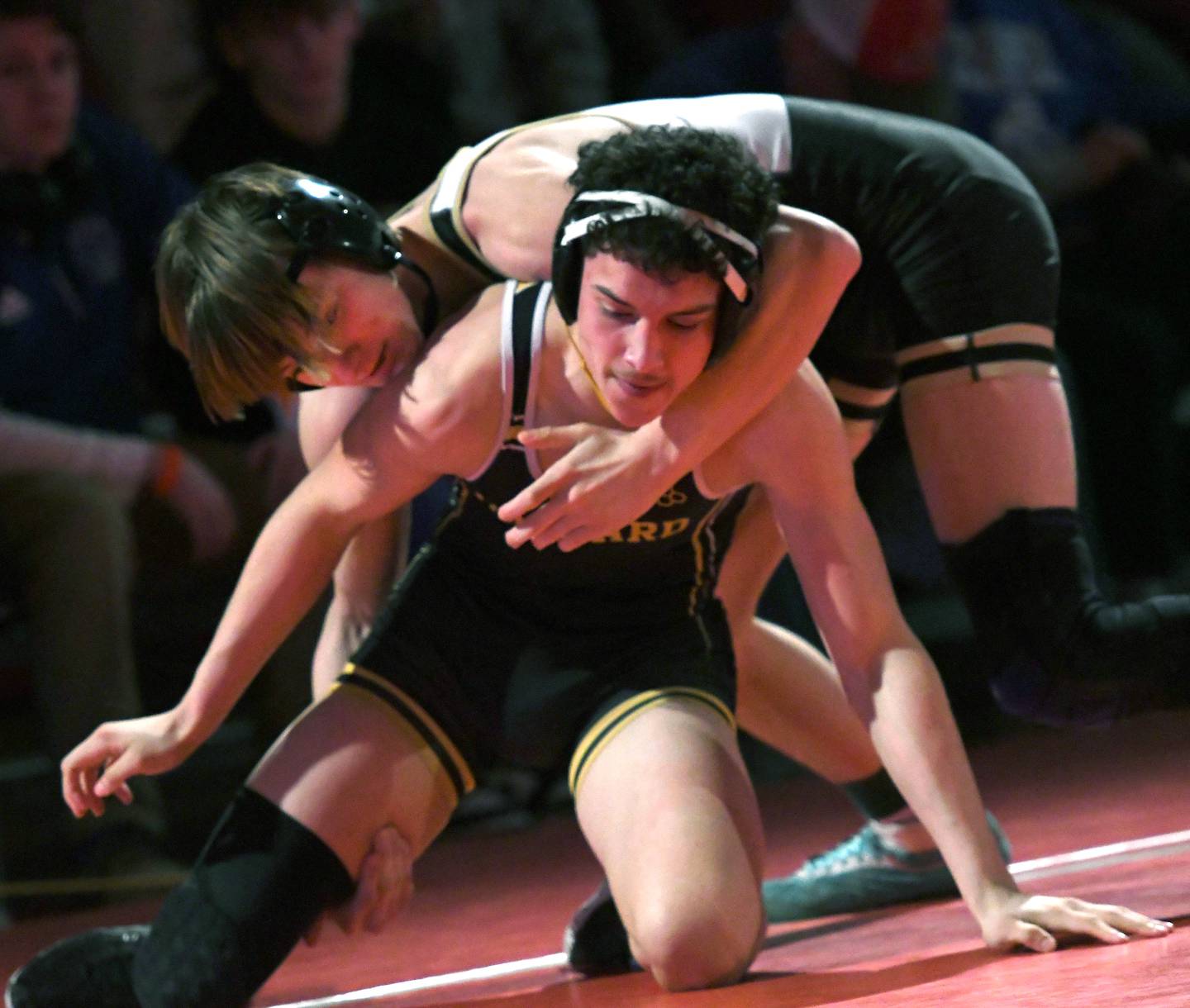 Polo's Wyatt Doty (top) wrestlesHarvard's Marques Merida for third place at 132 pounds at the 1A Oregon Wrestling Sectional on Saturday. Doty won the match, but both wrestlers advance to the state finals.