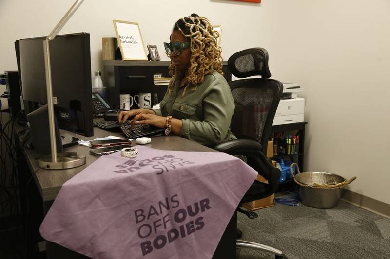 Kawanna Shannon, director of patient access at Planned Parenthood of the St. Louis Region and Southwest Missouri, works at her desk at the Planned Parenthood clinic in downstate Illinois' Fairview Heights. The Missouri abortion-rights advocacy chapter opened the clinic in Illinois because of restrictions placed on access to services in Missouri.