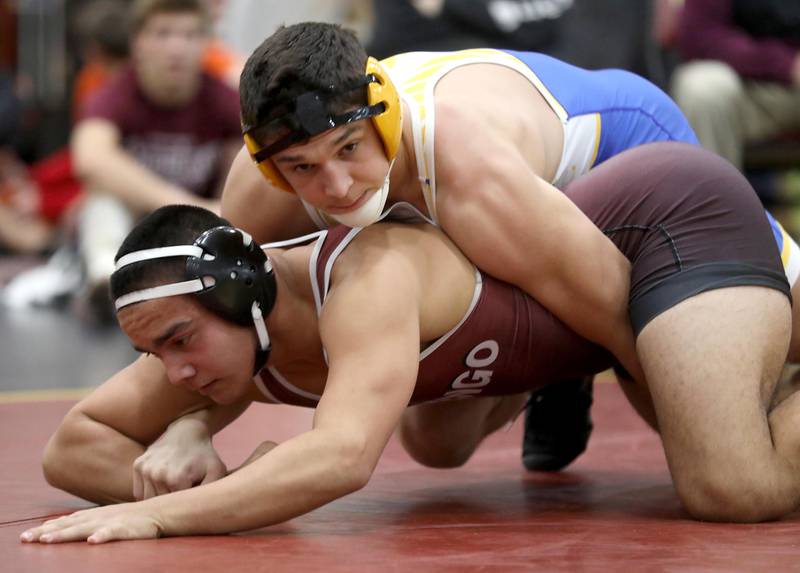 Johnsburg’s Duke Mays controls Marengo’s Frankie Solis during a190-pound match in the Tom DuBois Invite wrestling meet on Saturday, Dec. 13, 2025, at Richmond-Burton High School in Richmond.