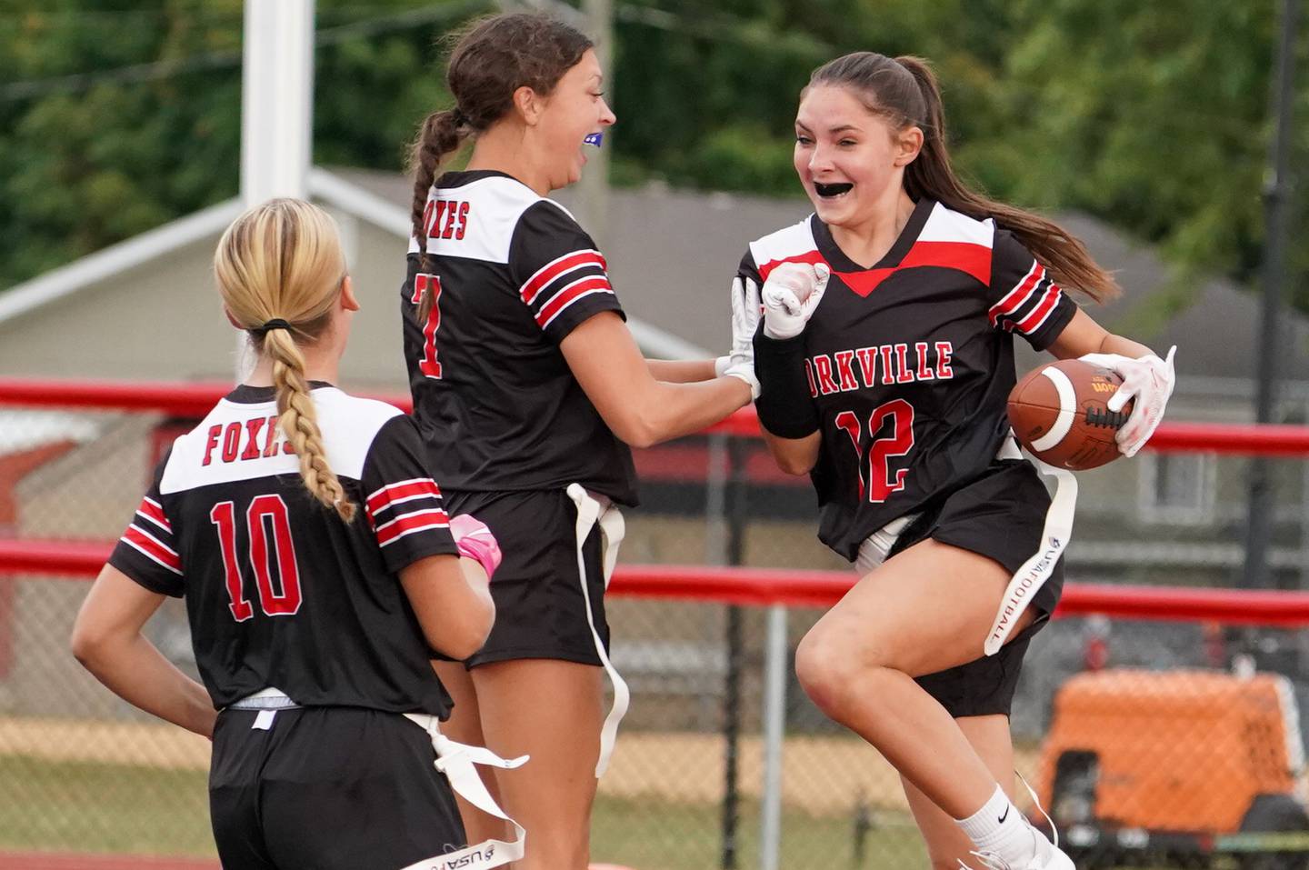 Yorkville's Hayden Hodges (12) smiles after scoring on an interception against Joliet Central during a flag football game at Yorkville High School on Monday, Sep 23, 2024.