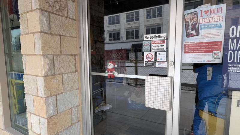Santa greets visitors to Prison City Vintage clothing store on Thursday, Dec. 19, 2024, at 72 N. Chicago St. in Joliet.
