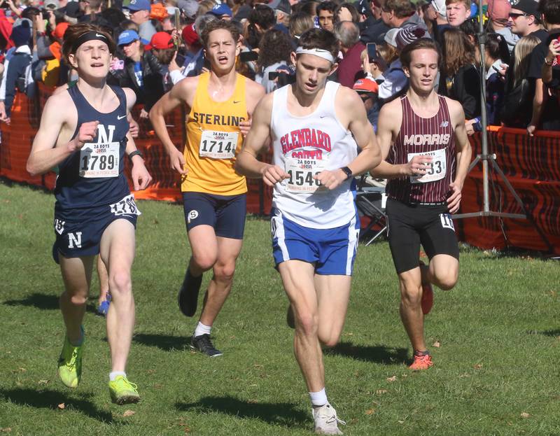 Nazareth Academy's Daniel Lewis, Sterling's Charlies Johnson, Glenbard South's Kurt Storckman, and Morris's Brodie Peterson  compete in the Class 2A State Cross Country race on Saturday, Nov. 4, 2023 at Detweiller Park in Peoria.