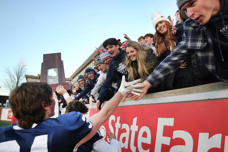 Cary-Grove players celebrate with fans Saturday, Nov. 25, 2023, after their win over East St. Louis in the IHSA Class 6A state championship game in Hancock Stadium at Illinois State University in Normal.