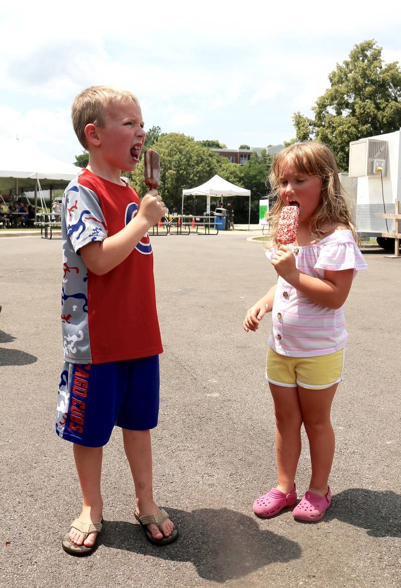 Shane and Garen Reardon enjoy ice cream at the Windmill City Festival in Batavia on Saturday, July 13, 2024 in Batavia.