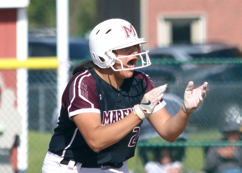 Marengo’s Arianna Rodriguez gets revved up after reaching first base safely on a single against Aurora Central Catholic in IHSA Class 2A Regional Title Game action softball at Marengo High School in Marengo on Friday, May 23, 2025.