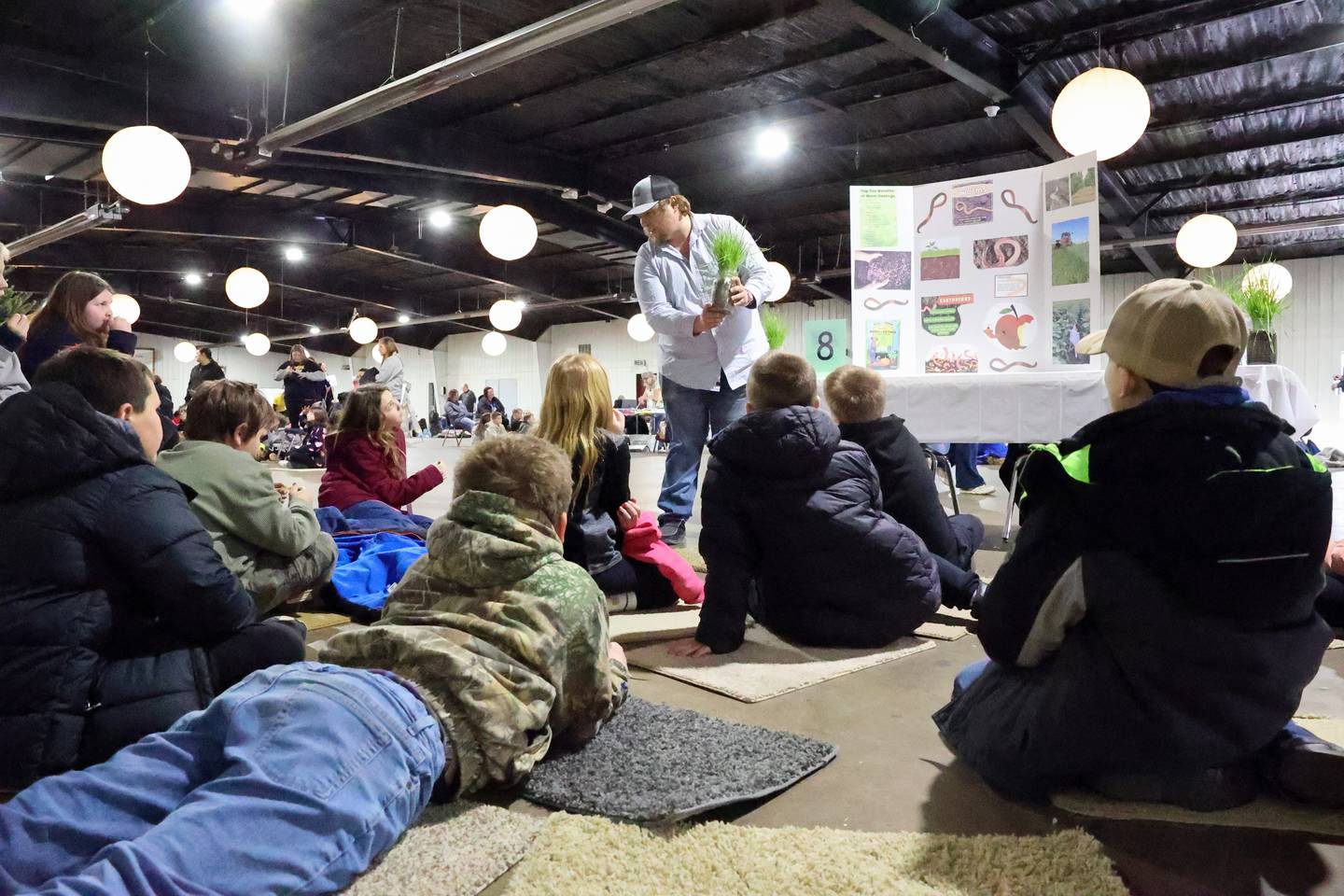 Cody Rollins, of Rollins Ag in St. Anne, gives a presentation about vermiculture, the practice of cultivating composting worms, to fourth-graders during the Kankakee County Farm Bureau's 22nd Kids Day at the Farm held Thursday, March 20, at the Kankakee County Fairgrounds.