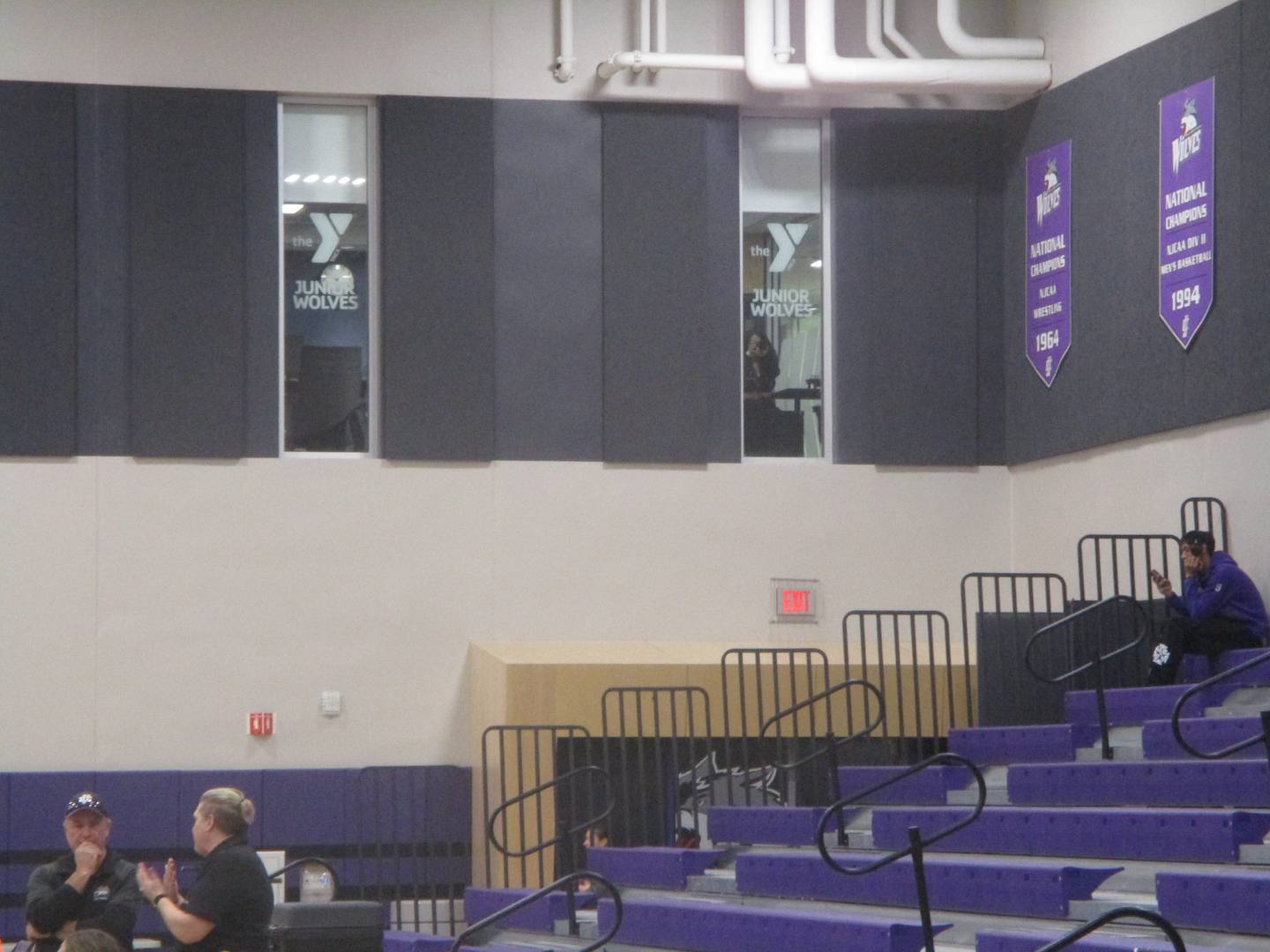 The YMCA emblem can be seen in the windows of the new office for the Greater Joliet Area YMCA overlooking the gym at the Joliet Junior College Event Center. Feb. 6, 2025