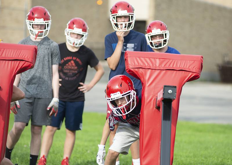 Morrison football players run through drills Tuesday, July 26, 2022. The team will open the season against Newman on August 26.