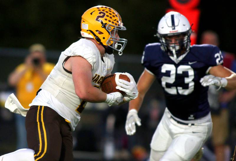 Jacobs’ Caden DuMelle runs the ball in varsity football on Friday, Sept. 20, 2024, at Al Bohrer Field on the campus of Cary-Grove High School in Cary.