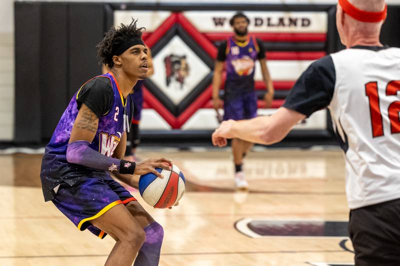 Lucius “Too Tall” Winston (2) of the Harlem Wizards looks to shoot three pointer on Wednesday, April 16, 2025 at Woodland High School in Streator.