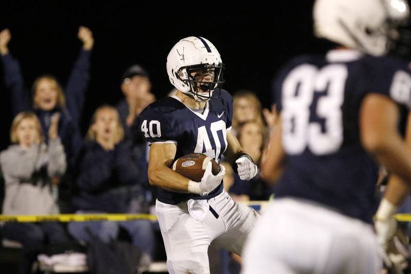 Cary-Grove's Wade Abrams celebrates his touchdown against Jacobs during their football game at Cary-Grove High School on Friday, Oct. 8, 2021 in Cary.