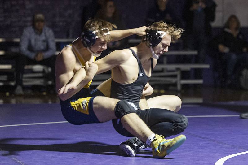 Sterling’s Tommy Tate (left) pulls down Dixon’s Jayce Kastner Tuesday, Jan. 10, 2023. Tate won by pin.