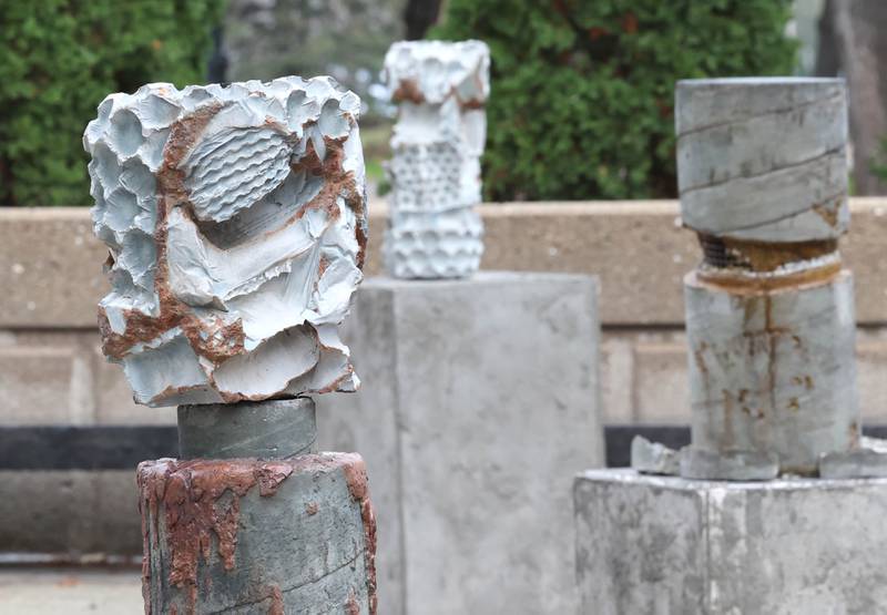 The sculpture "Foundations of Character" by Erinn Stuart Wednesday, Nov. 8, 2023, outside the Northern Illinois University School of Art and Design, Visual Arts Building. The piece is part of the Terrain Biennial 2023, a countrywide exhibit where artists display their work outside of homes and building around town.
