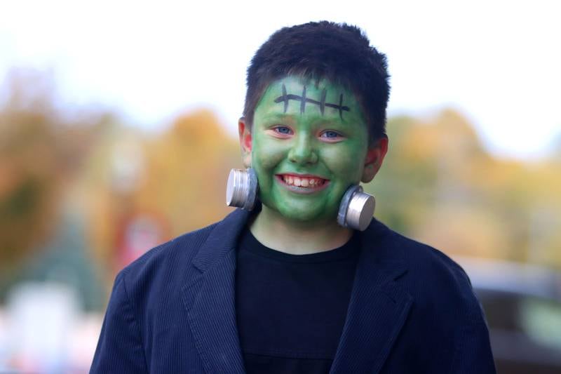 Preston Orlando, 7, of Crystal Lake trick-or-treats in downtown Crystal Lake on Friday, October. 31, 2025