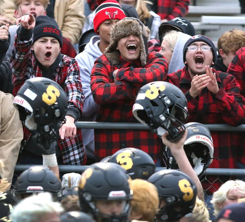 Sycamore players celebrate with their fans after the Spartans defeated St. Patrick 14-0 in their IHSA Class 5A state quarterfinal game Saturday, Nov. 13, 2021, at Sycamore High School.