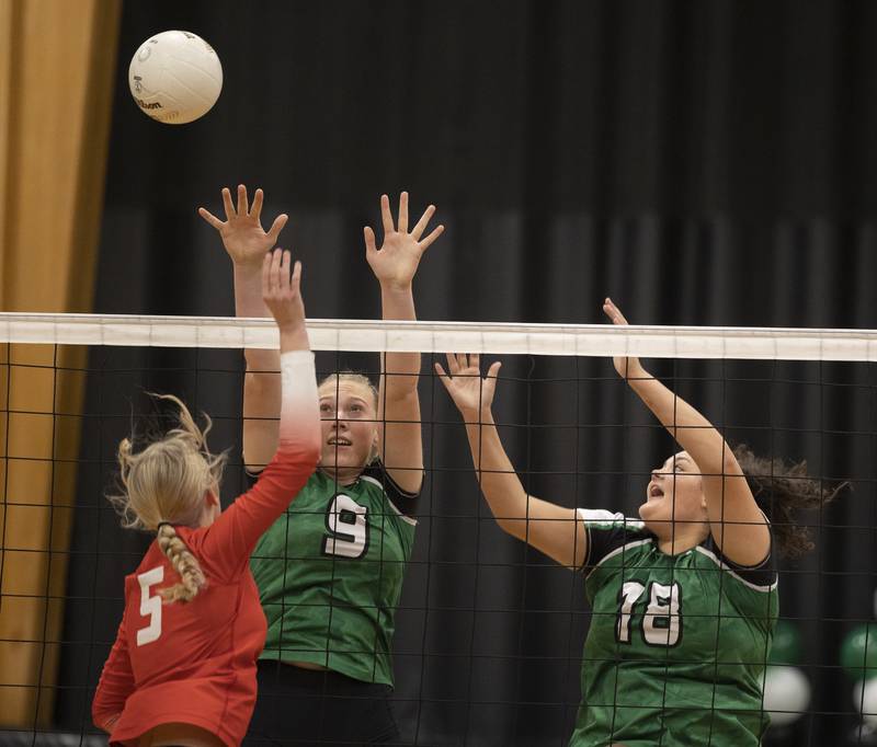 Rock Falls' Kayla Hackbarth (left) and Ari Reyna work against Oregon’s Skylar Bishop Wednesday, Oct. 22, 2025.