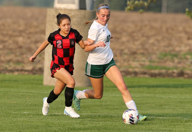 Indian Creek's Sally Diaz and Alleman's Carson Wendt chase down the ball during their Class 1A sectional final game Friday, May 19, 2023, at Hinckley-Big Rock High School.