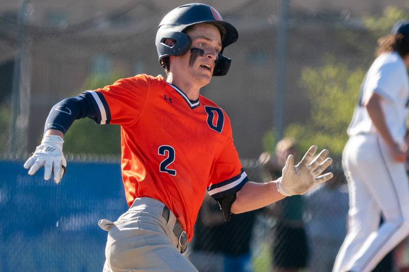 Oswego’s Chase Gerwig (2) doubles against Oswego East during a baseball game at Oswego East High School on Wednesday, May 10, 2023.