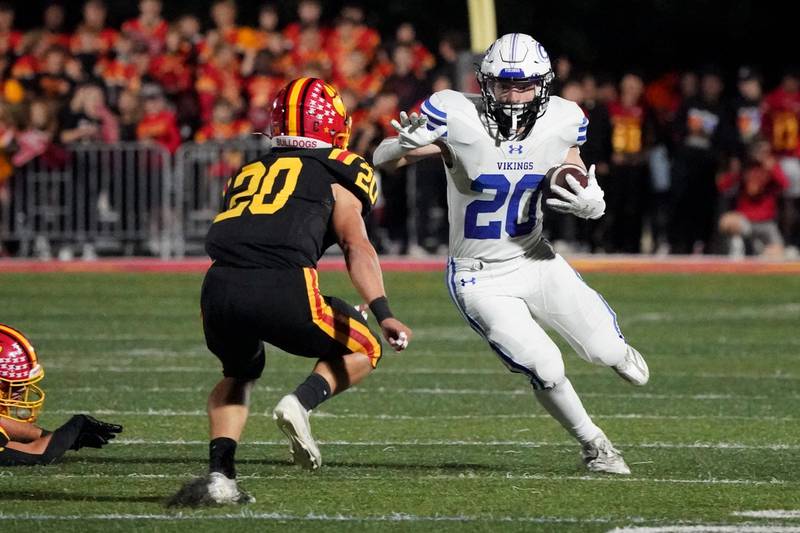 Geneva’s Michael Rumoro (right) carries the ball against Batavia’s Chase Osborne (left) during a football game at Batavia High School on Friday, Oct. 4, 2024.