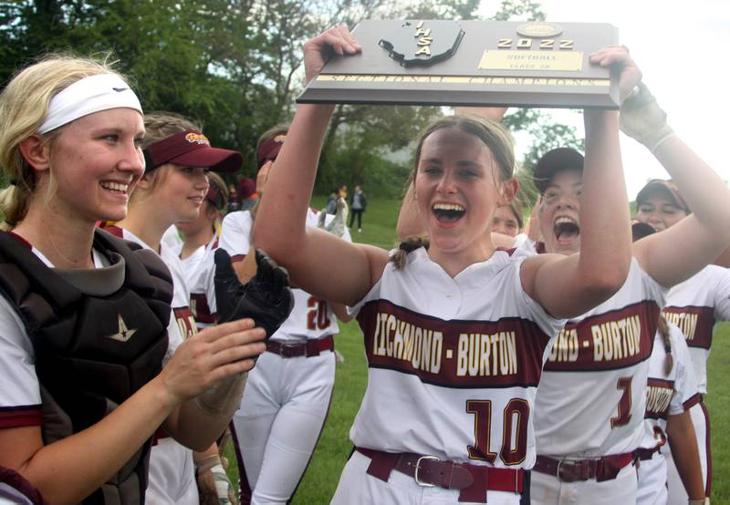 Richmond-Burton battery mates Taylor Davison, left, and Hailey Holtz celebrate with teammates after a win over Stillman Valley in softball sectional title game action in Richmond Friday evening.