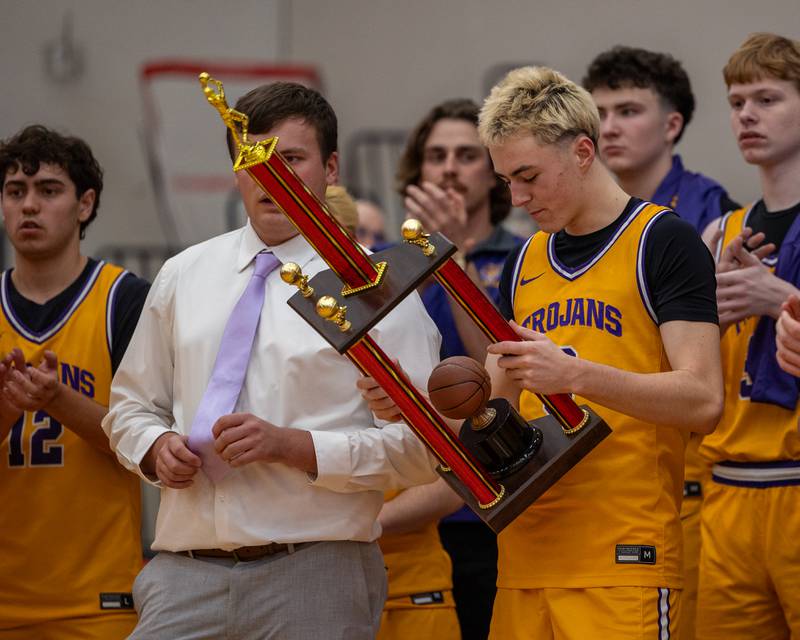 Alex Beetz (3) of Mendota looks down at Colmone Classic Championship Trophy on Saturday, December 20, 2025 at Hall High School in Spring Valley.