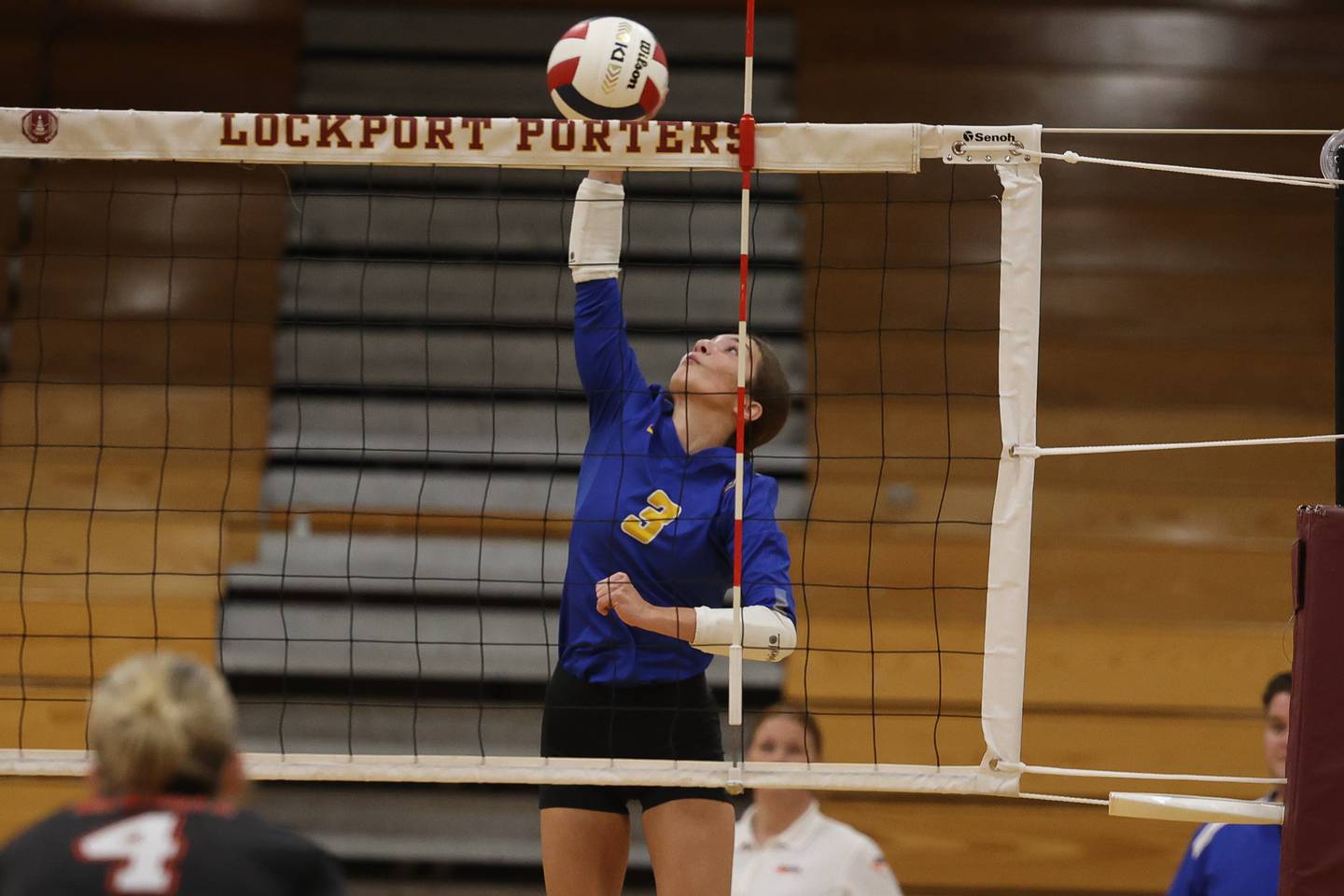 Joliet Central’s Delany Moran stretches for the kill against Plainfield East in the Class 3A Lockport Regional quarterfinal on Monday, Oct. 28, 2024 in Lockport.