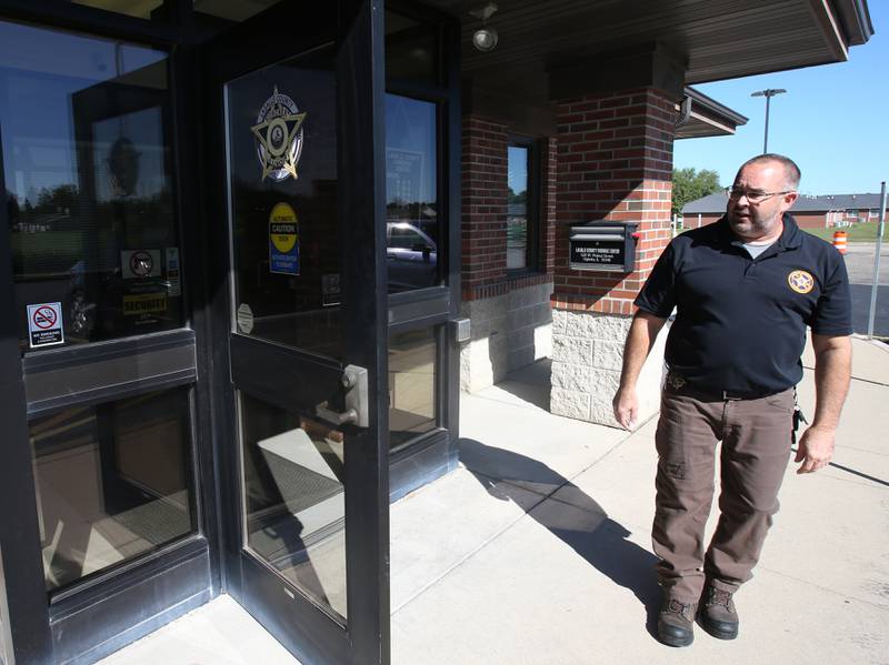 La Salle County Corner Rich Ploch watches the automatic door close in front of him at the La Salle County Forensic Center on Wednesday, Aug. 30, 2023 in Oglesby. The La Salle County Corner office is now located at 520 West Walnut Street in Oglesby. The former office at the La Salle County Governmental Complex in Ottawa was not handicap accessible.