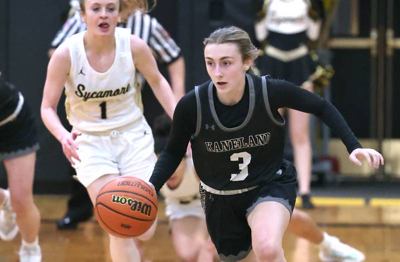 Kaneland's Alexis Schueler pushes the ball ahead of Sycamore's Mallory Armstrong during the Class 3A regional final game Friday, Feb. 17, 2023, at Sycamore High School.