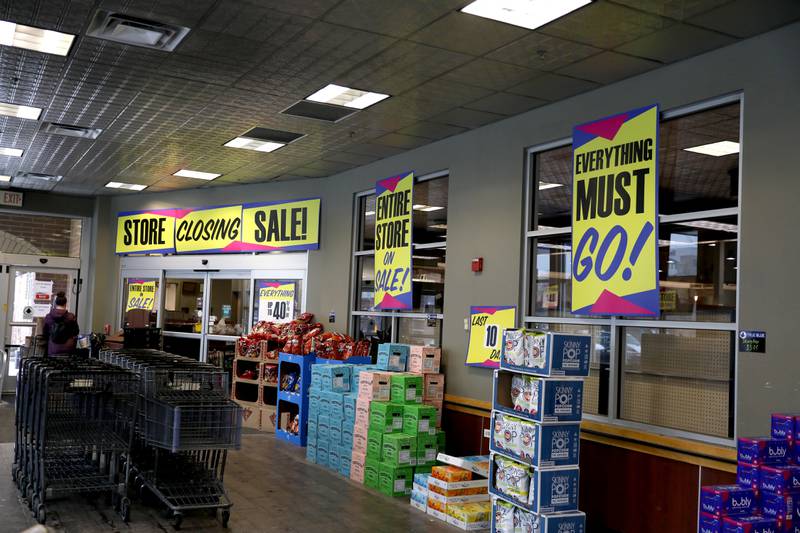 “Store Closing” signs surround the Blue Goose Market in St. Charles on Thursday, Feb. 24, 2022.
