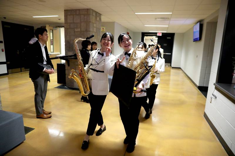 The Inagakuen Sogo High School Wind Orchestra from Japan proceeds to the auditorium on Wednesday, Dec. 18, 2024 at the Batavia Fine Arts Centre.