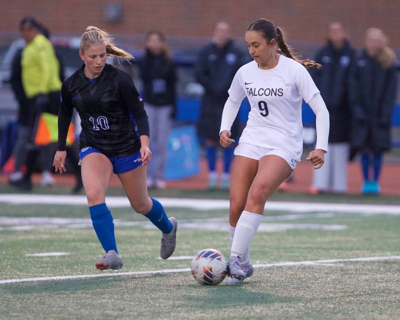 Wheaton North's Tali Kaempf looks to control the ball against  St. Charles North's Chloe Kirsten on Thursday, April 10,2025 in St. Charles.