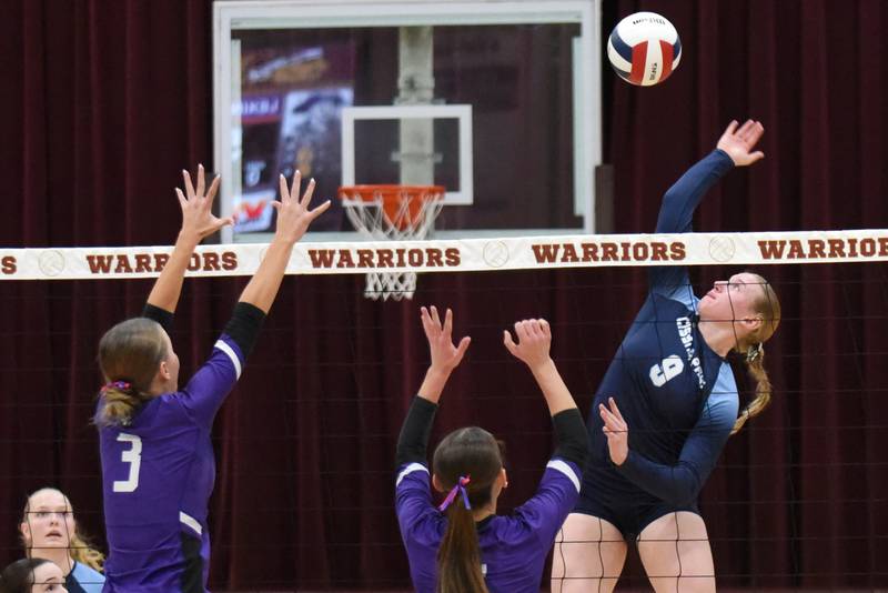 Cissna Park's Addison Lucht, right, looks to send a hit over a pair of Lexington defenders during the IHSA Class 1A Watseka Sectional championship Thursday, Nov. 6, 2025.